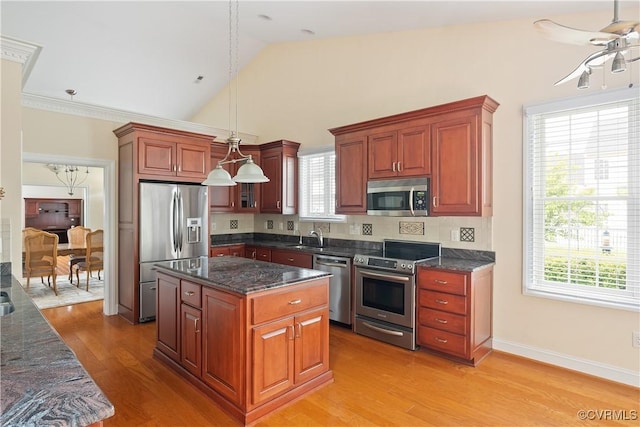 9428 Berry Patch Ln, Mechanicsville, VA 23116 - kitchen with stainless steel appliances, a sink, ceiling fan, plenty of natural light, and lofted ceiling