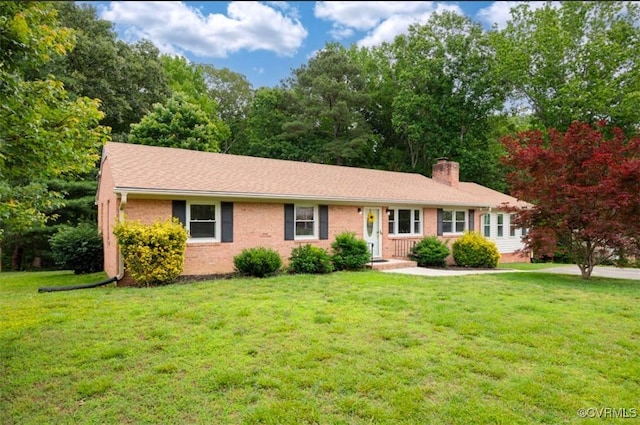 5401 Carteret Rd, Chesterfield, VA 23832 - ranch-style house with a chimney, a front yard, and brick siding