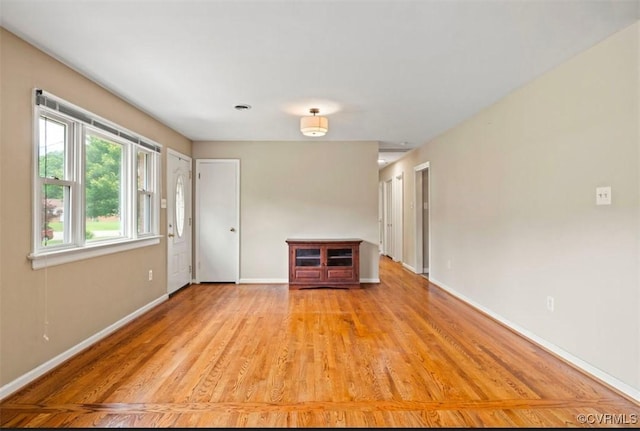 5401 Carteret Rd, Chesterfield, VA 23832 - unfurnished living room featuring baseboards and light wood-style flooring