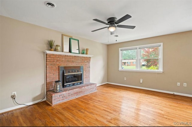 5401 Carteret Rd, Chesterfield, VA 23832 - unfurnished living room with wood finished floors, baseboards, ceiling fan, and a fireplace