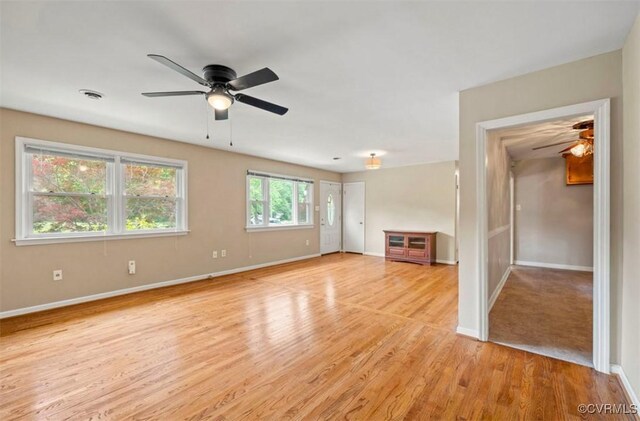 5401 Carteret Rd, Chesterfield, VA 23832 - unfurnished living room featuring a ceiling fan, baseboards, and light wood-style flooring