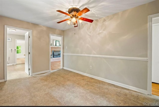 5401 Carteret Rd, Chesterfield, VA 23832 - carpeted empty room featuring ceiling fan, baseboards, and a brick fireplace
