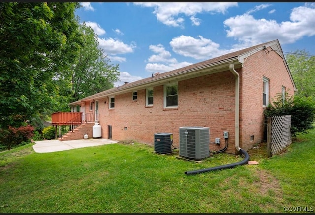 5401 Carteret Rd, Chesterfield, VA 23832 - rear view of property featuring central AC, brick siding, a yard, and a patio area