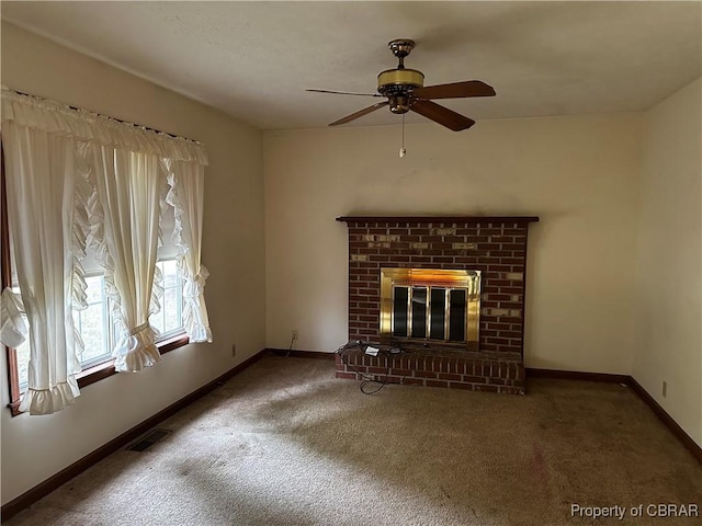 1097 Ebenezer Church Rd, Cobbs Creek, VA 23035 - unfurnished living room with carpet floors, a ceiling fan, baseboards, and a brick fireplace