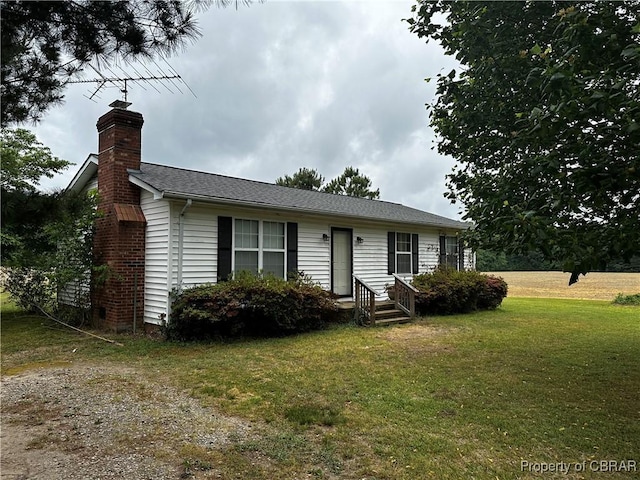1097 Ebenezer Church Rd, Cobbs Creek, VA 23035 - view of front facade featuring a chimney and a front yard