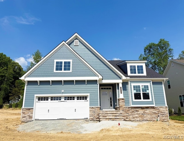 12540 N Readers Ln, Manakin Sabot, VA 23103 - craftsman house featuring stone siding, dirt driveway, and a garage