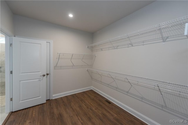 12540 N Readers Ln, Manakin Sabot, VA 23103 - walk in closet featuring dark wood finished floors
