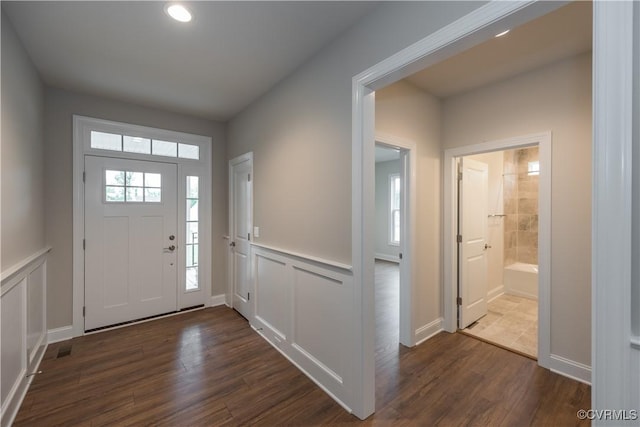 12540 N Readers Ln, Manakin Sabot, VA 23103 - entryway with dark wood-style floors, wainscoting, recessed lighting, and a decorative wall