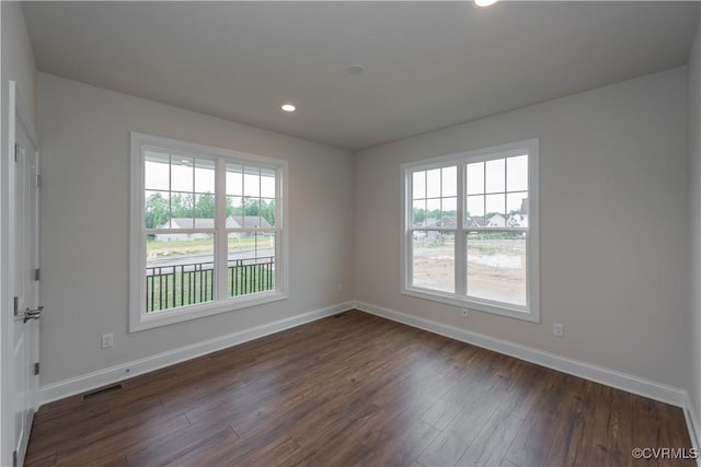 12540 N Readers Ln, Manakin Sabot, VA 23103 - unfurnished room with baseboards, healthy amount of natural light, dark wood-type flooring, and recessed lighting