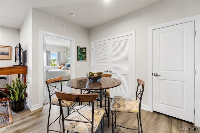 3700 Maze Runner Dr Unit 204, Midlothian, VA 23112 - dining area featuring light wood-style flooring and baseboards