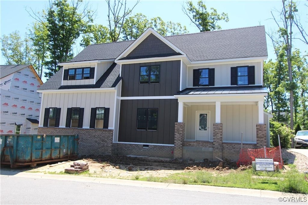 3628 Seaford Crossing Dr, Midlothian, VA 23113 - view of front of home featuring board and batten siding, a shingled roof, a porch, and a standing seam roof