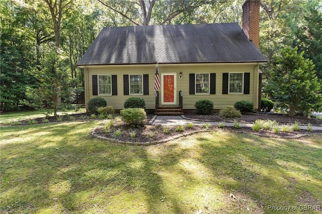 542 Cod Creek Dr, Heathsville, VA 22473 - cape cod home with entry steps, a chimney, and a front lawn