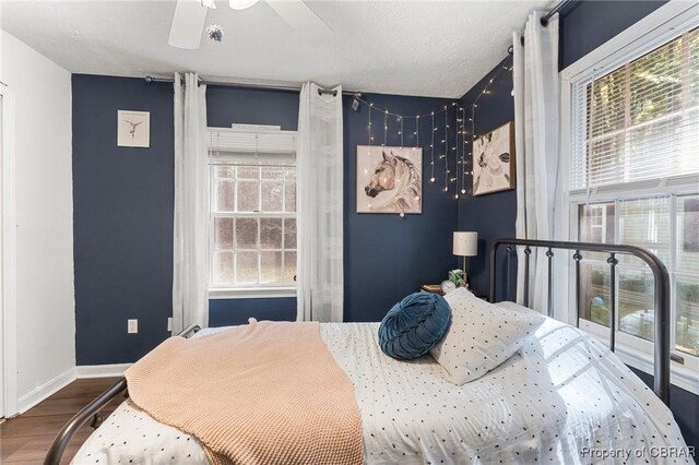 542 Cod Creek Dr, Heathsville, VA 22473 - bedroom featuring wood finished floors, baseboards, and ceiling fan