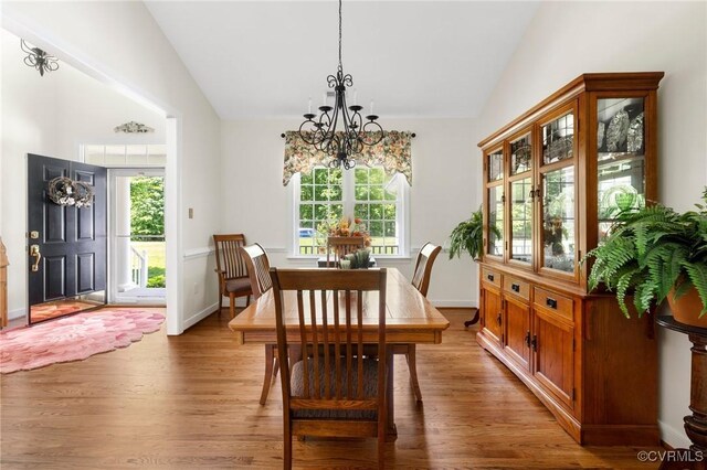 1629 Olmstead Dr, Powhatan, VA 23139 - dining space featuring lofted ceiling, a chandelier, wood finished floors, healthy amount of natural light, and baseboards