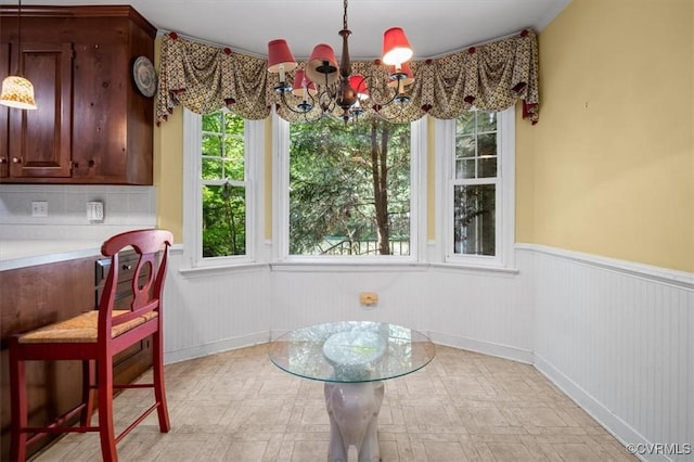 11309 Pendleton Pl, North Chesterfield, VA 23236 - dining room featuring a chandelier and wainscoting