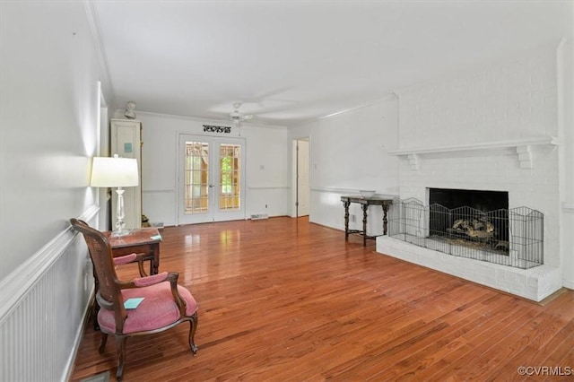 11309 Pendleton Pl, North Chesterfield, VA 23236 - living room with ceiling fan, wood finished floors, a fireplace, and ornamental molding