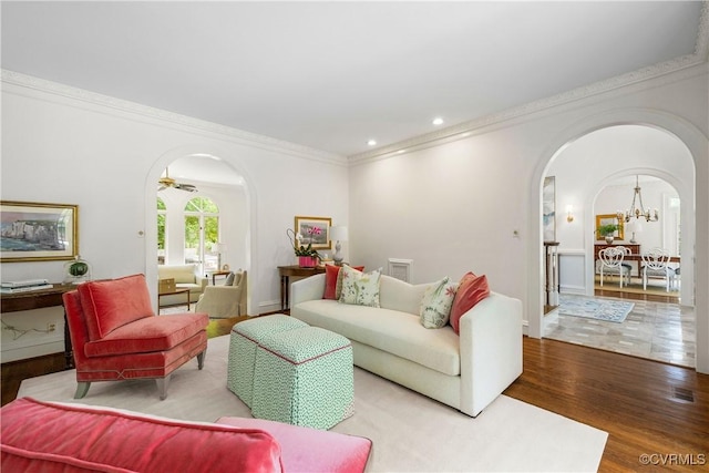 9001 Forest Ridge Ct, Henrico, VA 23229 - living area with arched walkways, wood finished floors, ornamental molding, a chandelier, and recessed lighting