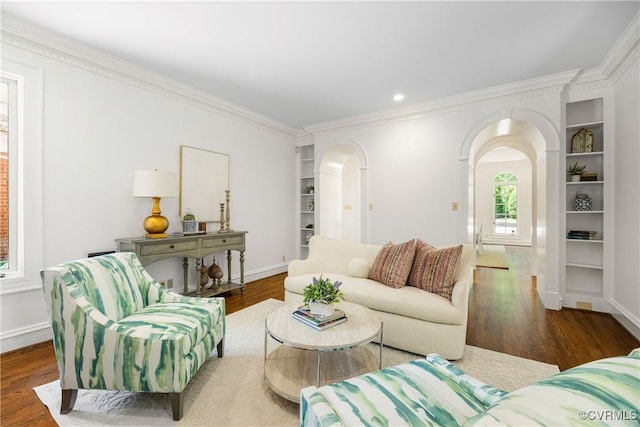 9001 Forest Ridge Ct, Henrico, VA 23229 - living area featuring arched walkways, ornamental molding, wood finished floors, baseboards, and built in shelves