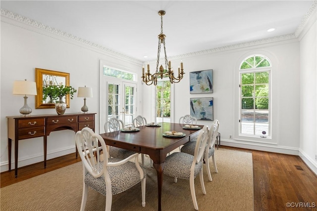 9001 Forest Ridge Ct, Henrico, VA 23229 - dining area featuring a chandelier, wood finished floors, crown molding, and baseboards