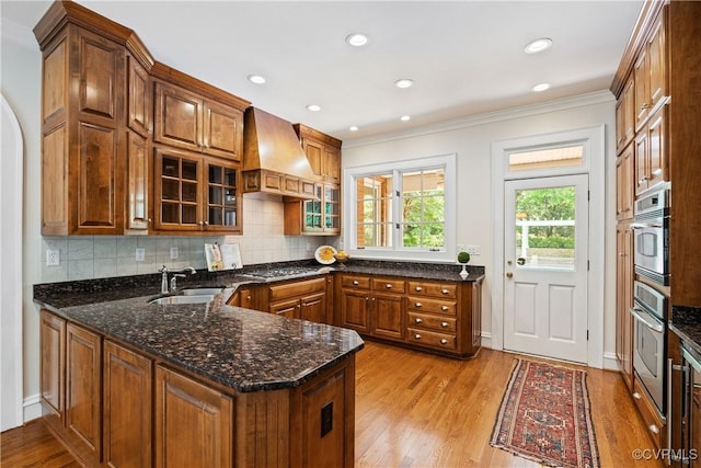 9001 Forest Ridge Ct, Henrico, VA 23229 - kitchen with premium range hood, a sink, appliances with stainless steel finishes, crown molding, and light wood finished floors
