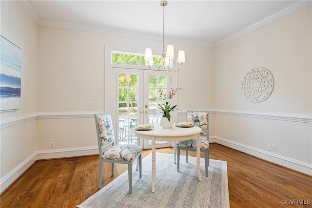 9001 Forest Ridge Ct, Henrico, VA 23229 - dining space featuring a chandelier, baseboards, wood finished floors, crown molding, and french doors
