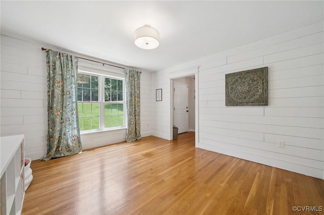 2554 Walkers Ridge Ter, Powhatan, VA 23139 - unfurnished room with light wood finished floors and wooden walls