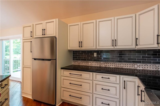 1396 Gray Fox Rd, Goochland, VA 23103 - kitchen with freestanding refrigerator, dark countertops, tasteful backsplash, and dark wood-type flooring