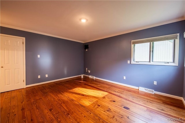 1396 Gray Fox Rd, Goochland, VA 23103 - empty room featuring wood finished floors, baseboards, and ornamental molding