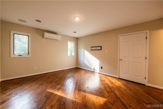 1396 Gray Fox Rd, Goochland, VA 23103 - empty room featuring a wall mounted air conditioner, baseboards, and wood finished floors