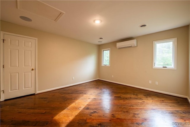 1396 Gray Fox Rd, Goochland, VA 23103 - spare room featuring a wall mounted air conditioner, baseboards, and dark wood finished floors