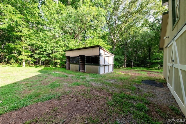 1396 Gray Fox Rd, Goochland, VA 23103 - view of green lawn featuring an outbuilding, a storage shed, and a wooded view