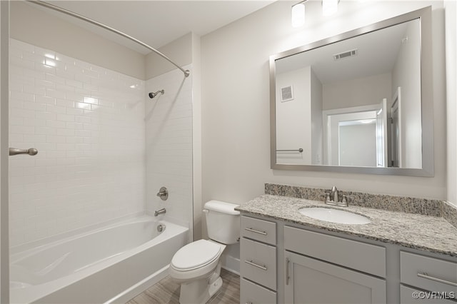10530 Stony Bluff Dr Unit 305, Ashland, VA 23005 - bathroom featuring toilet, wood finished floors, vanity, shower / bath combination, and baseboards
