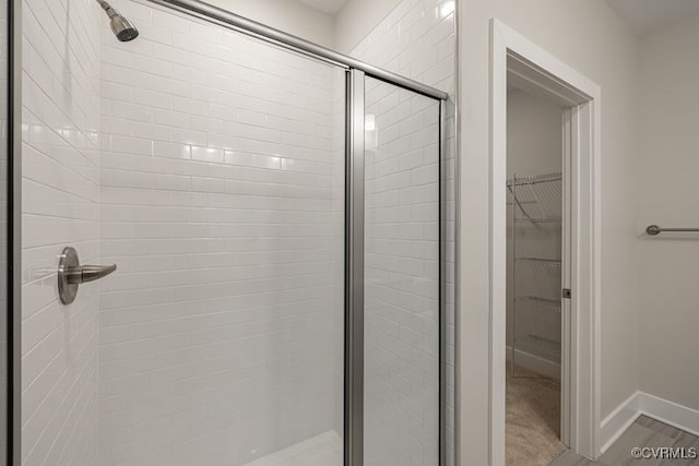 10530 Stony Bluff Dr Unit 305, Ashland, VA 23005 - full bath featuring a shower stall, a spacious closet, and baseboards