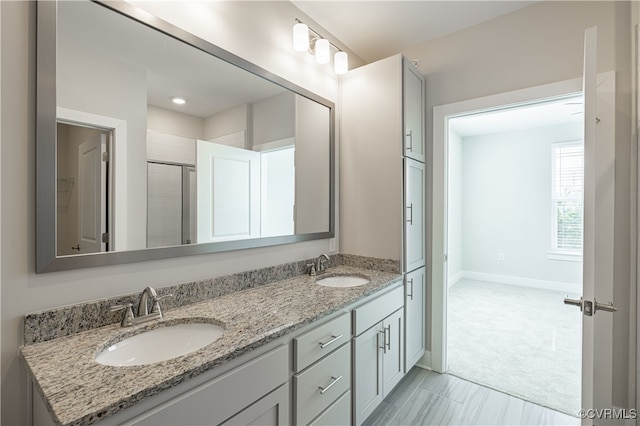 10530 Stony Bluff Dr Unit 305, Ashland, VA 23005 - full bath featuring double vanity, baseboards, and a shower with shower door