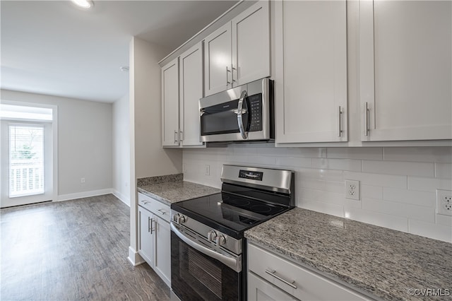 10530 Stony Bluff Dr Unit 305, Ashland, VA 23005 - kitchen featuring stainless steel appliances, light stone counters, decorative backsplash, wood finished floors, and baseboards