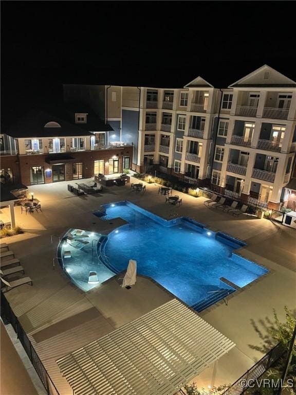 10530 Stony Bluff Dr Unit 305, Ashland, VA 23005 - pool at night with a patio area and a community pool