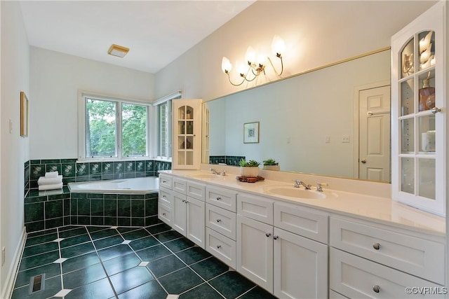 8831 Whistling Swan Rd, Chesterfield, VA 23838 - full bath with tile patterned floors, double vanity, a garden tub, and a chandelier