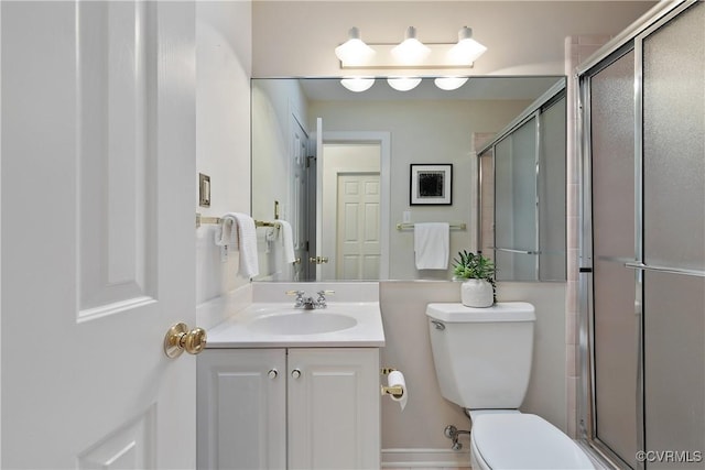 8831 Whistling Swan Rd, Chesterfield, VA 23838 - bathroom with toilet, vanity, and a shower stall