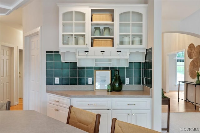 8831 Whistling Swan Rd, Chesterfield, VA 23838 - kitchen with white cabinets, glass insert cabinets, light countertops, and tasteful backsplash