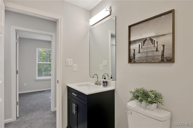 11202 Heathstead Rd, Chester, VA 23831 - bathroom featuring toilet, vanity, and baseboards