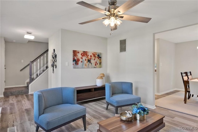 11202 Heathstead Rd, Chester, VA 23831 - living area featuring wood finished floors, ceiling fan, baseboards, and stairway
