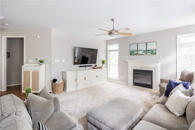 12109 Jamieson Pl, Henrico, VA 23059 - living area with a ceiling fan, a glass covered fireplace, and baseboards