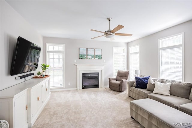 12109 Jamieson Pl, Henrico, VA 23059 - living room with a ceiling fan, a glass covered fireplace, light colored carpet, and baseboards