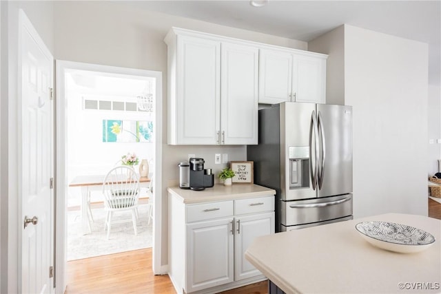 12109 Jamieson Pl, Henrico, VA 23059 - kitchen featuring stainless steel refrigerator with ice dispenser, light wood-style floors, white cabinetry, and light countertops