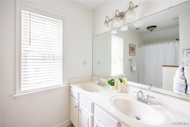 12109 Jamieson Pl, Henrico, VA 23059 - bathroom featuring double vanity and plenty of natural light