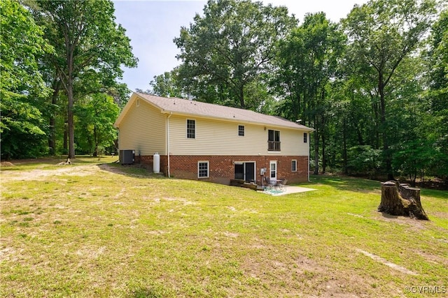 17063 Moores Mill Rd, Ruther Glen, VA 22546 - rear view of property with central air condition unit, a patio area, a yard, and brick siding