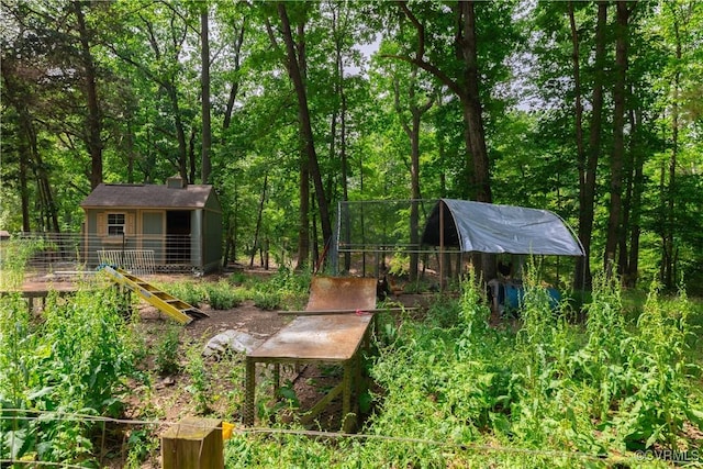 17063 Moores Mill Rd, Ruther Glen, VA 22546 - view of yard with an outdoor structure and a view of trees