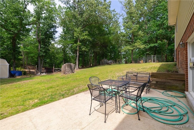 17063 Moores Mill Rd, Ruther Glen, VA 22546 - view of patio featuring outdoor dining area and view of scattered trees