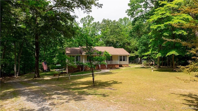 17063 Moores Mill Rd, Ruther Glen, VA 22546 - ranch-style home with covered porch, a front lawn, and crawl space