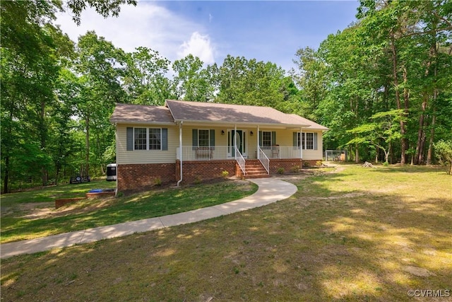 17063 Moores Mill Rd, Ruther Glen, VA 22546 - ranch-style house featuring a porch and a front yard